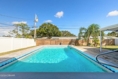 Welcome to this stunning 2-bedroom, 2-bathroom pool home located on Daytona Beach Golf Club in Florida - for sale on GolfHomes.com, golf home, golf lot