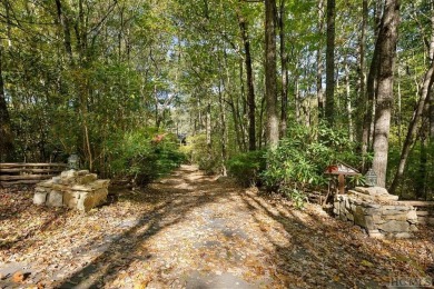 Nestled on a sprawling private lot, this enchanting on Sapphire National Golf Club in North Carolina - for sale on GolfHomes.com, golf home, golf lot