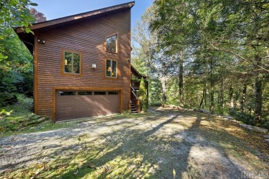 Nestled on a sprawling private lot, this enchanting on Sapphire National Golf Club in North Carolina - for sale on GolfHomes.com, golf home, golf lot