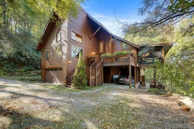 Nestled on a sprawling private lot, this enchanting on Sapphire National Golf Club in North Carolina - for sale on GolfHomes.com, golf home, golf lot