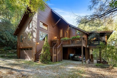 Nestled on a sprawling private lot, this enchanting on Sapphire National Golf Club in North Carolina - for sale on GolfHomes.com, golf home, golf lot