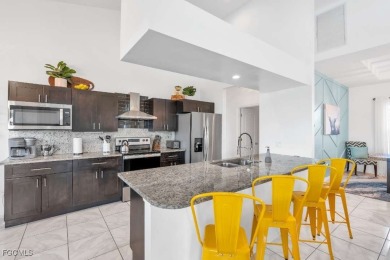 Welcome to 1720 SW 49th Ln, a charming 3-bedroom, 2-bathroom on Royal Tee Country Club in Florida - for sale on GolfHomes.com, golf home, golf lot