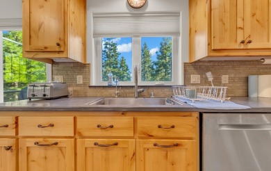 Nestled in the pines on a level two acre lot, this stunning on Lake Almanor West Golf Course in California - for sale on GolfHomes.com, golf home, golf lot