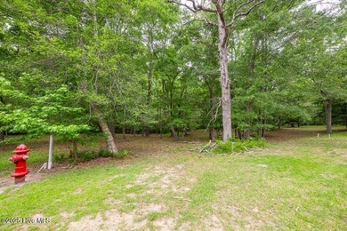 Discover the perfect spot to build your dream home on this on Rivers Edge Golf Club in North Carolina - for sale on GolfHomes.com, golf home, golf lot