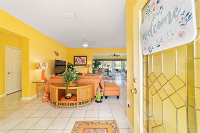 WOW is what you'll say as you step inside this custom Coral on Eagle Ridge At Spruce Creek Country Club in Florida - for sale on GolfHomes.com, golf home, golf lot