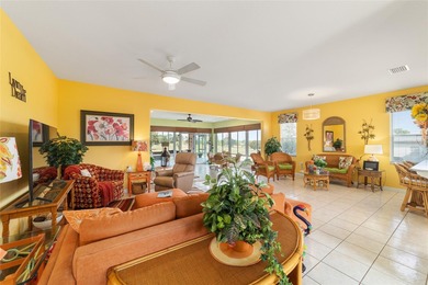 WOW is what you'll say as you step inside this custom Coral on Eagle Ridge At Spruce Creek Country Club in Florida - for sale on GolfHomes.com, golf home, golf lot