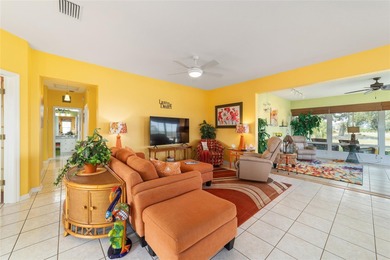 WOW is what you'll say as you step inside this custom Coral on Eagle Ridge At Spruce Creek Country Club in Florida - for sale on GolfHomes.com, golf home, golf lot