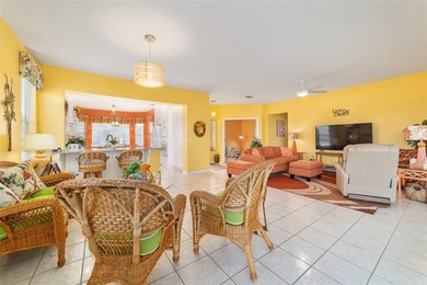 WOW is what you'll say as you step inside this custom Coral on Eagle Ridge At Spruce Creek Country Club in Florida - for sale on GolfHomes.com, golf home, golf lot