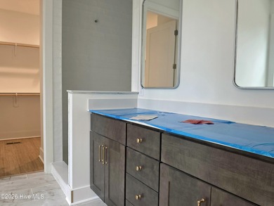 Discover refined living in this stunning new construction by on Seven Lakes Country Club in North Carolina - for sale on GolfHomes.com, golf home, golf lot