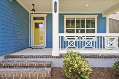 This beautiful and well-maintained coastal home is within on Cape Fear National At Brunswick Forest in North Carolina - for sale on GolfHomes.com, golf home, golf lot