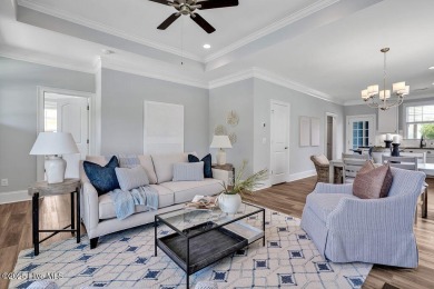 This beautiful and well-maintained coastal home is within on Cape Fear National At Brunswick Forest in North Carolina - for sale on GolfHomes.com, golf home, golf lot