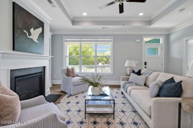 This beautiful and well-maintained coastal home is within on Cape Fear National At Brunswick Forest in North Carolina - for sale on GolfHomes.com, golf home, golf lot