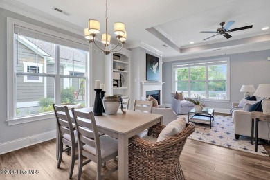 This beautiful and well-maintained coastal home is within on Cape Fear National At Brunswick Forest in North Carolina - for sale on GolfHomes.com, golf home, golf lot