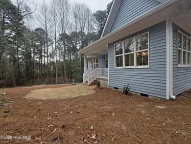 Discover refined living in this stunning new construction by on Seven Lakes Country Club in North Carolina - for sale on GolfHomes.com, golf home, golf lot