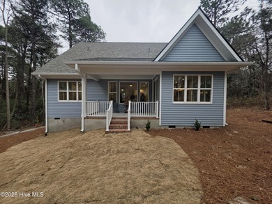 Discover refined living in this stunning new construction by on Seven Lakes Country Club in North Carolina - for sale on GolfHomes.com, golf home, golf lot