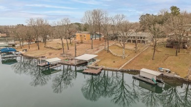 Wake up to stunning lake views and enjoy the best of waterfront on Cherokee Village North Course in Arkansas - for sale on GolfHomes.com, golf home, golf lot