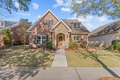 Tucked inside the Village of Highlands South, this 4-bedroom on Highland Oaks Golf Course in Alabama - for sale on GolfHomes.com, golf home, golf lot