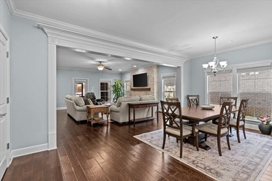 Tucked inside the Village of Highlands South, this 4-bedroom on Highland Oaks Golf Course in Alabama - for sale on GolfHomes.com, golf home, golf lot