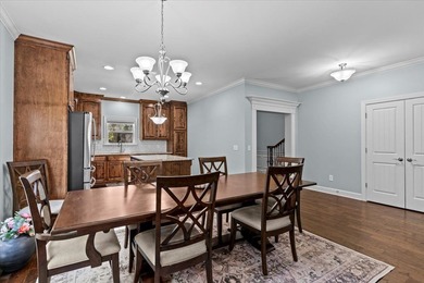 Tucked inside the Village of Highlands South, this 4-bedroom on Highland Oaks Golf Course in Alabama - for sale on GolfHomes.com, golf home, golf lot