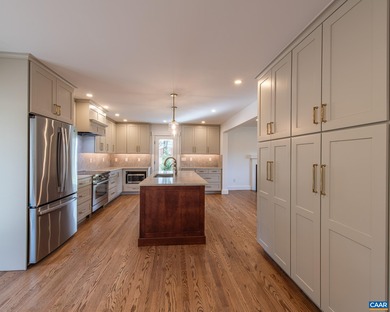 This newly remodeled 5-bedroom, 4-bath residence blends modern on Birdwood Golf Course in Virginia - for sale on GolfHomes.com, golf home, golf lot