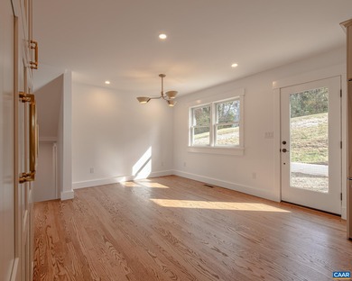 This newly remodeled 5-bedroom, 4-bath residence blends modern on Birdwood Golf Course in Virginia - for sale on GolfHomes.com, golf home, golf lot