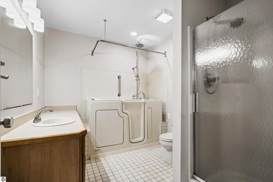 Welcome to this beautifully updated Turn-Key 2-bedroom, 2-bath on Traverse City Golf and Country Club in Michigan - for sale on GolfHomes.com, golf home, golf lot