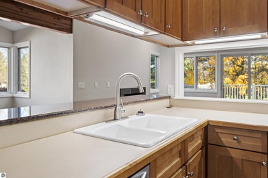 Welcome to this beautifully updated Turn-Key 2-bedroom, 2-bath on Traverse City Golf and Country Club in Michigan - for sale on GolfHomes.com, golf home, golf lot