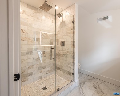 This newly remodeled 5-bedroom, 4-bath residence blends modern on Birdwood Golf Course in Virginia - for sale on GolfHomes.com, golf home, golf lot