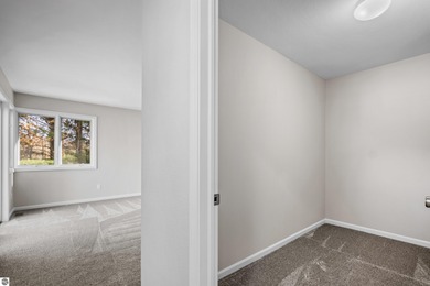 Welcome to this beautifully updated Turn-Key 2-bedroom, 2-bath on Traverse City Golf and Country Club in Michigan - for sale on GolfHomes.com, golf home, golf lot