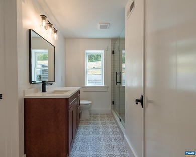 This newly remodeled 5-bedroom, 4-bath residence blends modern on Birdwood Golf Course in Virginia - for sale on GolfHomes.com, golf home, golf lot