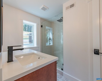 This newly remodeled 5-bedroom, 4-bath residence blends modern on Birdwood Golf Course in Virginia - for sale on GolfHomes.com, golf home, golf lot