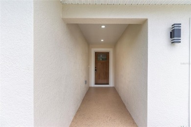 Welcome to this one-of-a-kind, newly built home in the heart of on Oak Hills Country Club in Florida - for sale on GolfHomes.com, golf home, golf lot