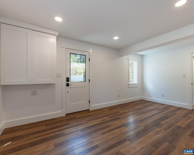 This newly remodeled 5-bedroom, 4-bath residence blends modern on Birdwood Golf Course in Virginia - for sale on GolfHomes.com, golf home, golf lot