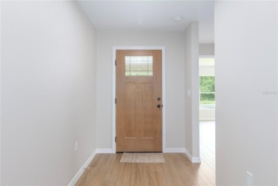 Welcome to this one-of-a-kind, newly built home in the heart of on Oak Hills Country Club in Florida - for sale on GolfHomes.com, golf home, golf lot