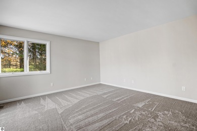 Welcome to this beautifully updated Turn-Key 2-bedroom, 2-bath on Traverse City Golf and Country Club in Michigan - for sale on GolfHomes.com, golf home, golf lot