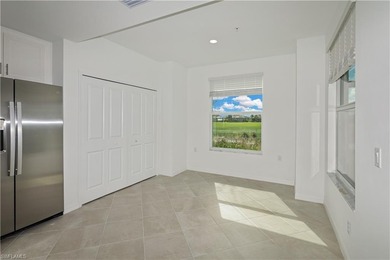 This southwest-facing GROUND FLOOR DiAngelo model, newly built on Panther Run Golf Club in Florida - for sale on GolfHomes.com, golf home, golf lot