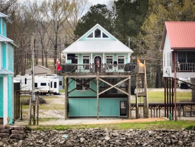 A river house with a view! This home offers 4 beds, 3 full baths on Tennessee River Golf Club in Tennessee - for sale on GolfHomes.com, golf home, golf lot