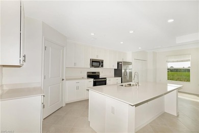 This southwest-facing GROUND FLOOR DiAngelo model, newly built on Panther Run Golf Club in Florida - for sale on GolfHomes.com, golf home, golf lot