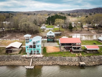 A river house with a view! This home offers 4 beds, 3 full baths on Tennessee River Golf Club in Tennessee - for sale on GolfHomes.com, golf home, golf lot