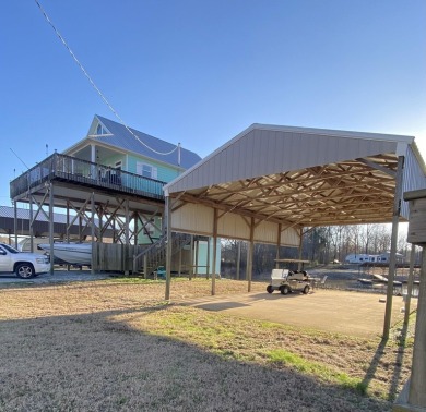 A river house with a view! This home offers 4 beds, 3 full baths on Tennessee River Golf Club in Tennessee - for sale on GolfHomes.com, golf home, golf lot