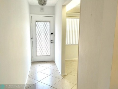 HANDYMAN SPECIAL. QUIET LOCATION CLOSE TO LYONS RD ENTRANCE on Wynmoor Golf Course in Florida - for sale on GolfHomes.com, golf home, golf lot