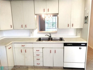 HANDYMAN SPECIAL. QUIET LOCATION CLOSE TO LYONS RD ENTRANCE on Wynmoor Golf Course in Florida - for sale on GolfHomes.com, golf home, golf lot