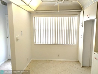 HANDYMAN SPECIAL. QUIET LOCATION CLOSE TO LYONS RD ENTRANCE on Wynmoor Golf Course in Florida - for sale on GolfHomes.com, golf home, golf lot