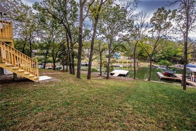 Wake up to stunning lake views and unwind in this quiet no wake on Sugar Valley Lakes Golf Course in Kansas - for sale on GolfHomes.com, golf home, golf lot