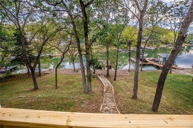 Wake up to stunning lake views and unwind in this quiet no wake on Sugar Valley Lakes Golf Course in Kansas - for sale on GolfHomes.com, golf home, golf lot