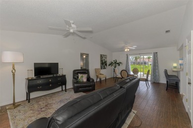 Charming 3-bedroom, 2-bathroom, canal-front home in the highly on Pinemoor West Golf Club in Florida - for sale on GolfHomes.com, golf home, golf lot