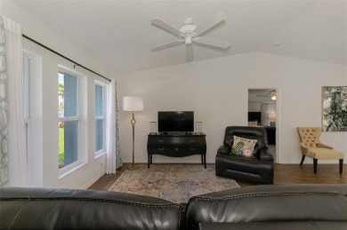 Charming 3-bedroom, 2-bathroom, canal-front home in the highly on Pinemoor West Golf Club in Florida - for sale on GolfHomes.com, golf home, golf lot