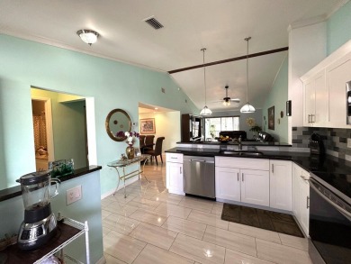 Beautifully renovated 2nd floor corner condo with expansive on Forest Oaks Golf Club in Florida - for sale on GolfHomes.com, golf home, golf lot