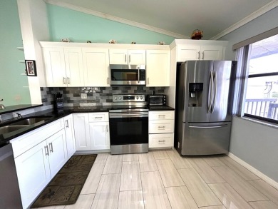 Beautifully renovated 2nd floor corner condo with expansive on Forest Oaks Golf Club in Florida - for sale on GolfHomes.com, golf home, golf lot