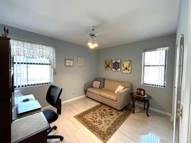 Beautifully renovated 2nd floor corner condo with expansive on Forest Oaks Golf Club in Florida - for sale on GolfHomes.com, golf home, golf lot